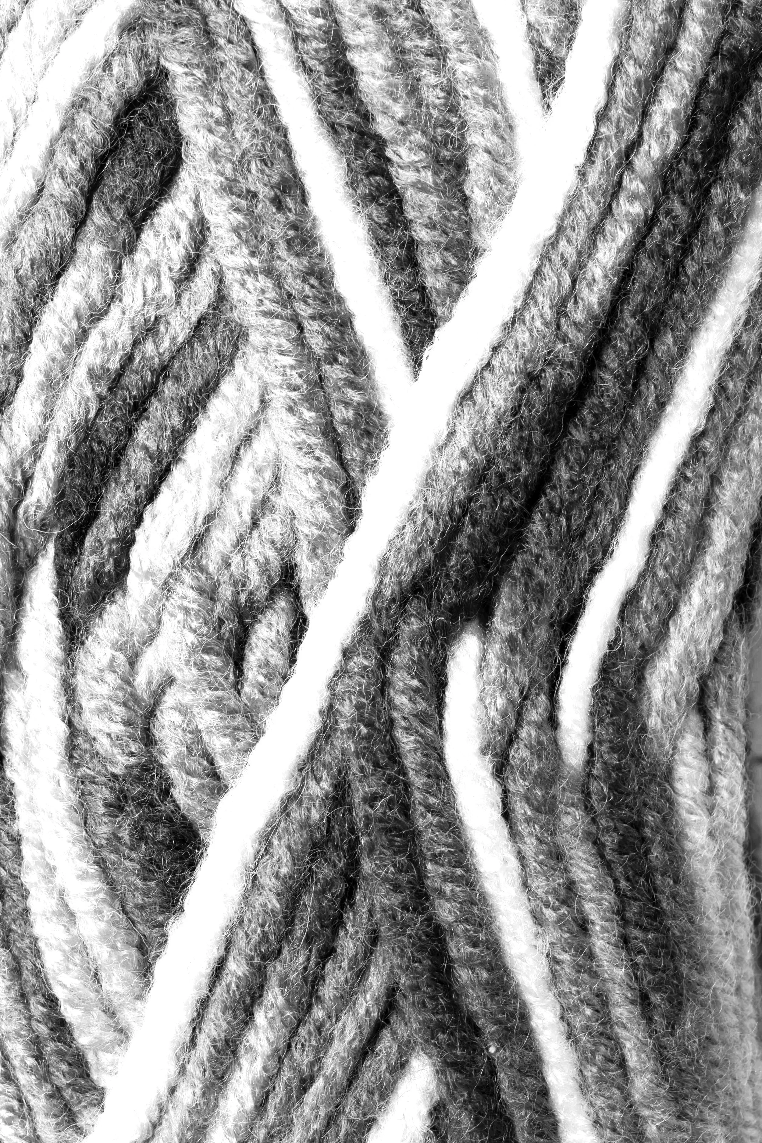 Close-up of gray and white yarn strands.