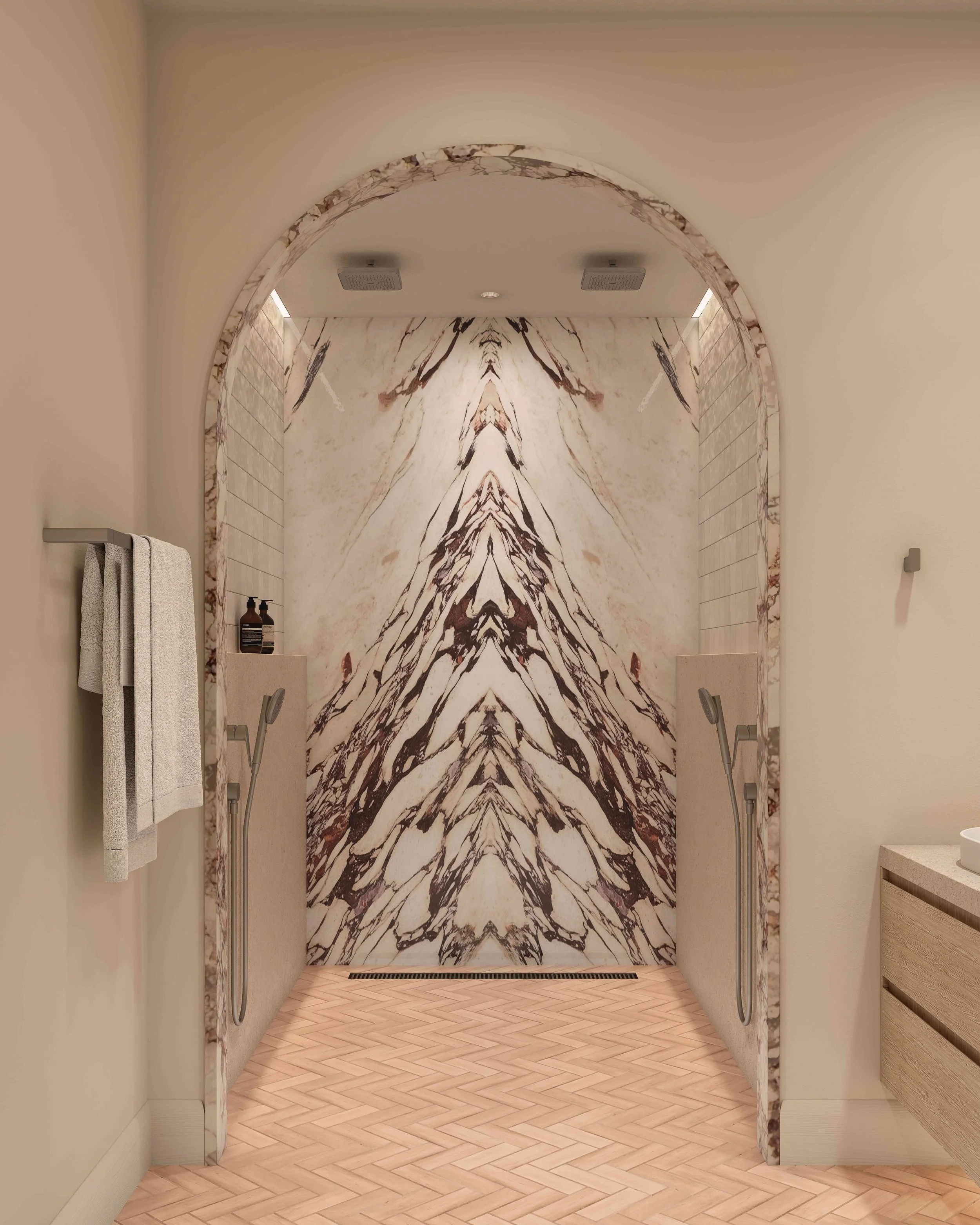 A luxurious shower area with an arched marble entrance features intricate marble wall patterns. The warm lighting and elegant tones create a soothing ambiance.