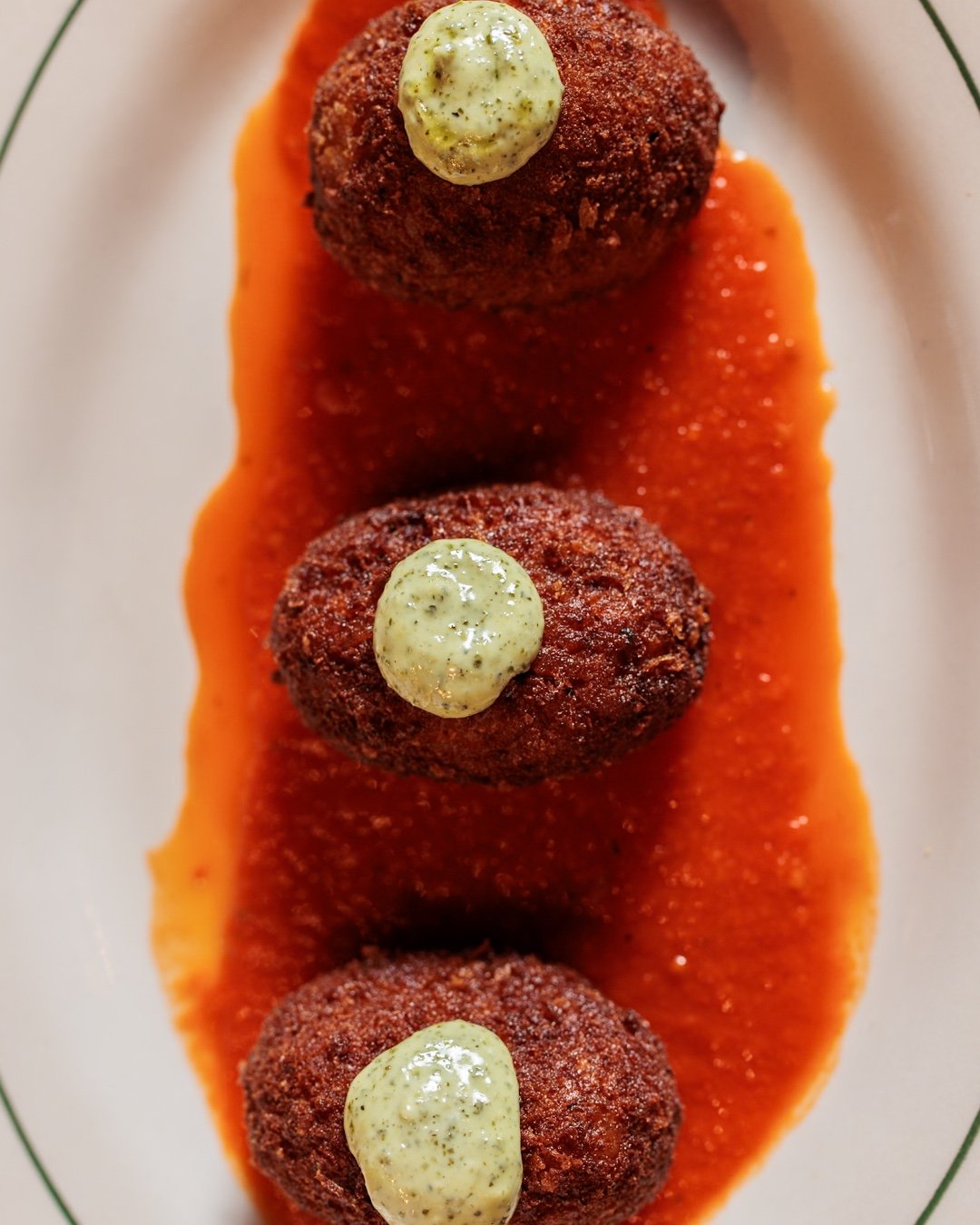 The kind of starter everyone quietly hopes you ordered.

Suppli | Roman-style rice balls stuffed with mozzarella, pecorino cheese, light tomato sauce.