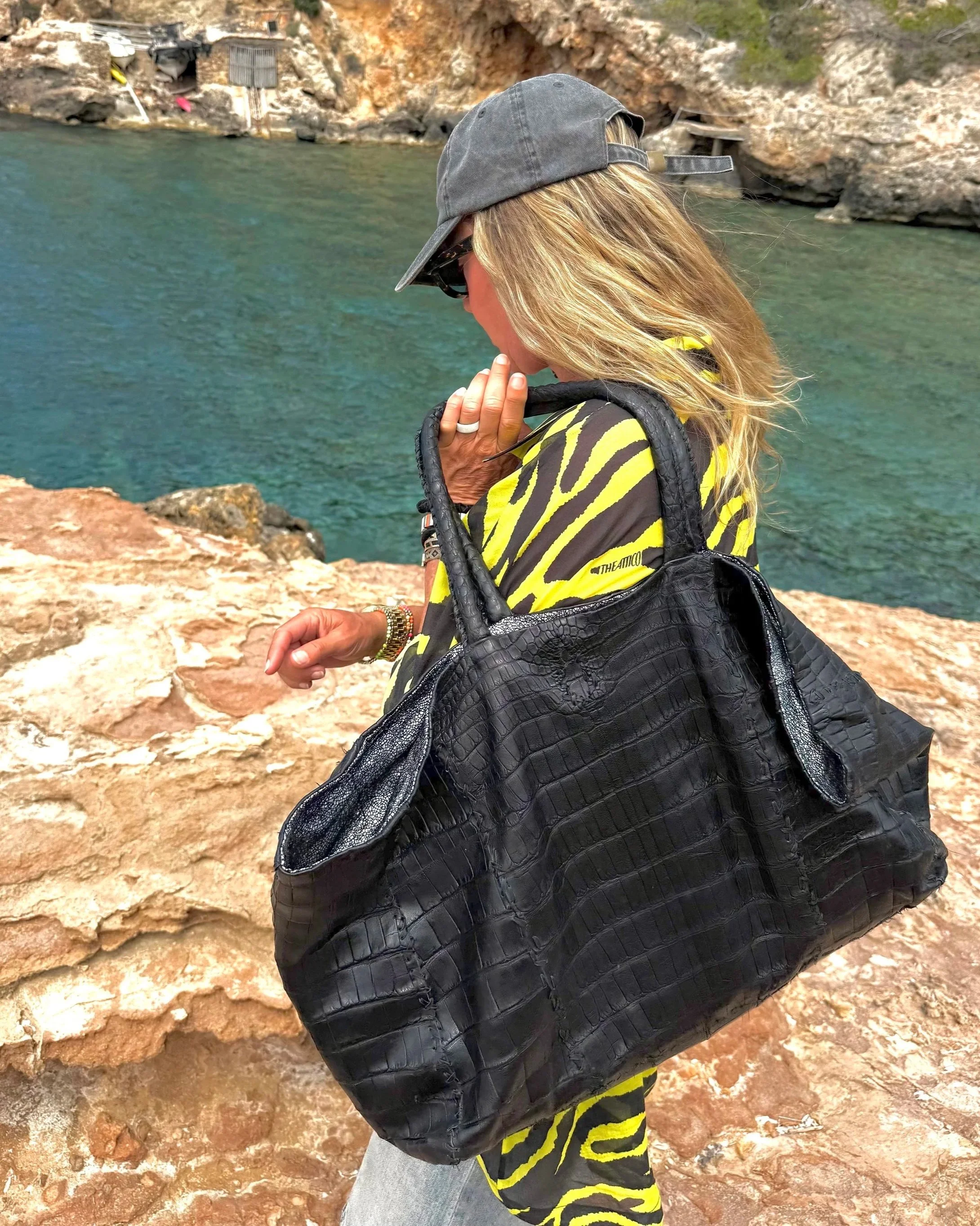 Oversized black leather tote bag showcasing the custom design options available at IZZEDIN STYLE.