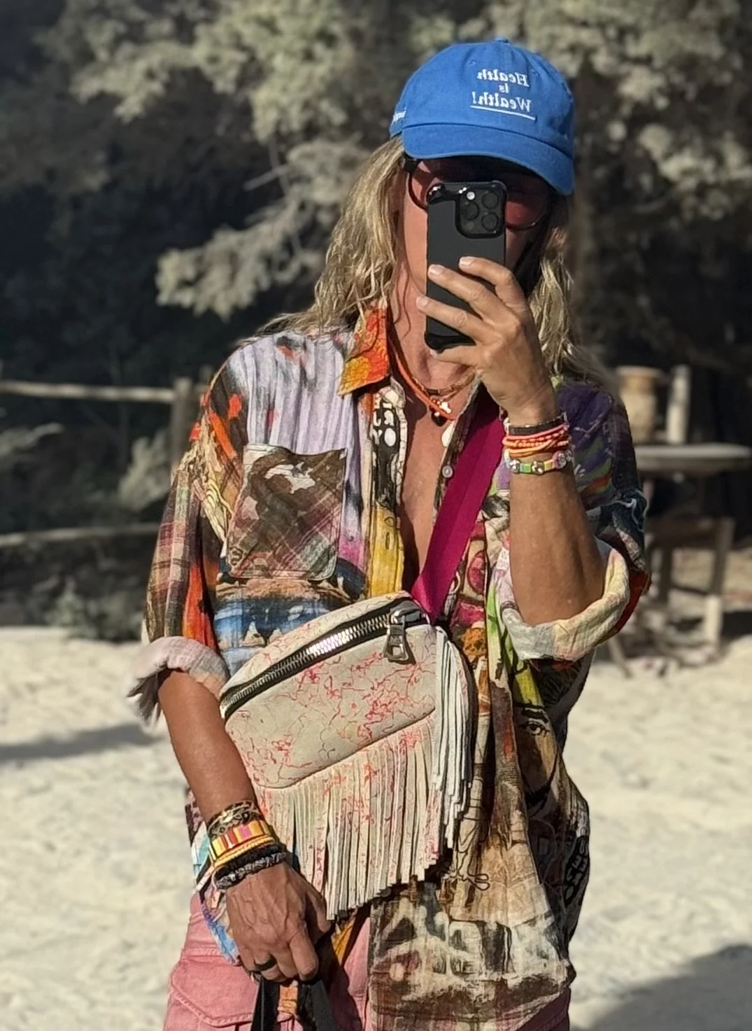 Diane carrying an IZZEDIN bag in an Ibiza-inspired beach setting.