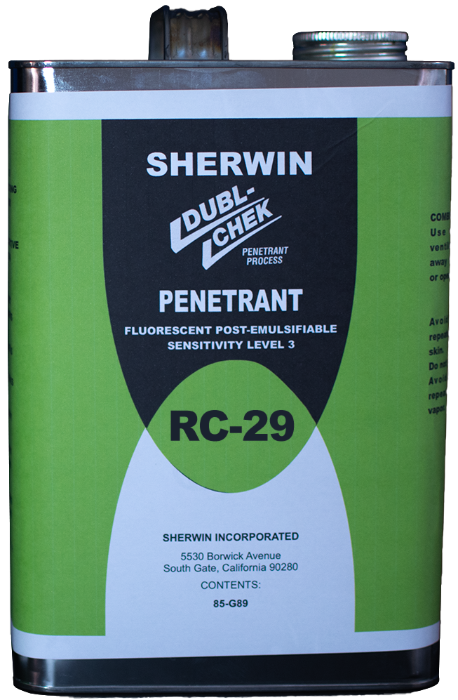 Lata de producto químico de color blanco con detalles en verde y negro, etiquetada como 'Sherwin Double Che Penetrant RC-29', utilizada para pruebas de penetración en inspección técnica.