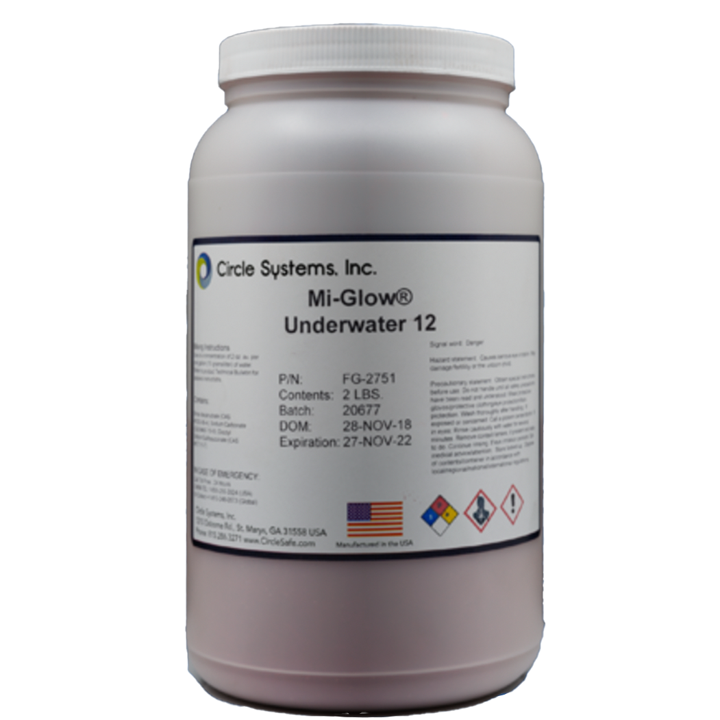 Un frasco blanco con etiqueta que indica que contiene un producto llamado Mi-Glow Underwater 12, fabricado en Estados Unidos. La etiqueta muestra símbolos de advertencia y detalles del lote, fecha de caducidad y peso.