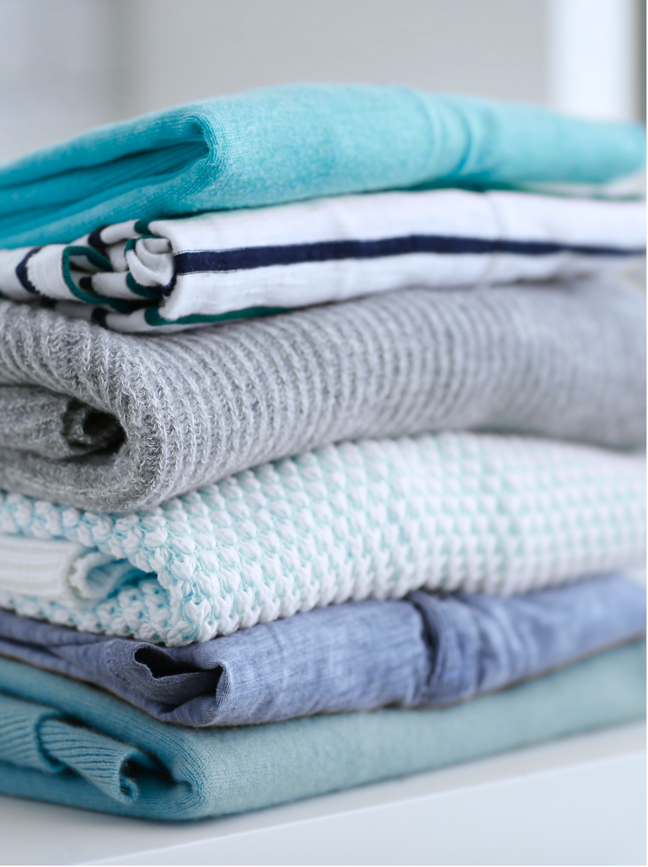 Stack of folded laundry in Davis California, at Davis Laundry clean laundromat near me