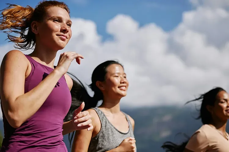 Photograph - Group of women running together as part of stress-anxiety-depression-treatment routine
