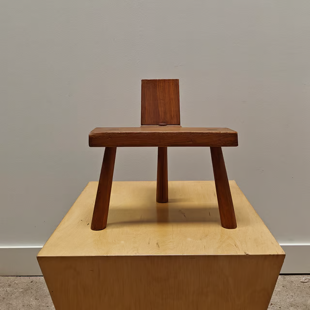 Decorative low three-legged stool