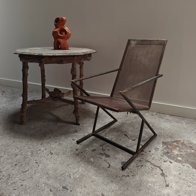 Studio made perforated zigzag armchair 5.png