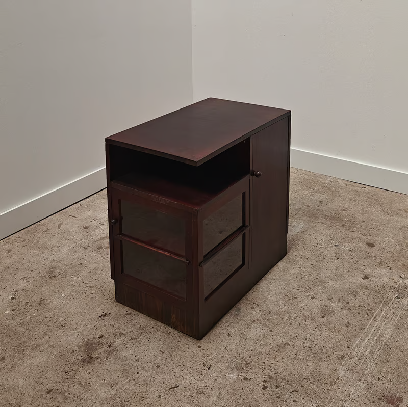 Dark asymmetrical Haagse school corner cupboard