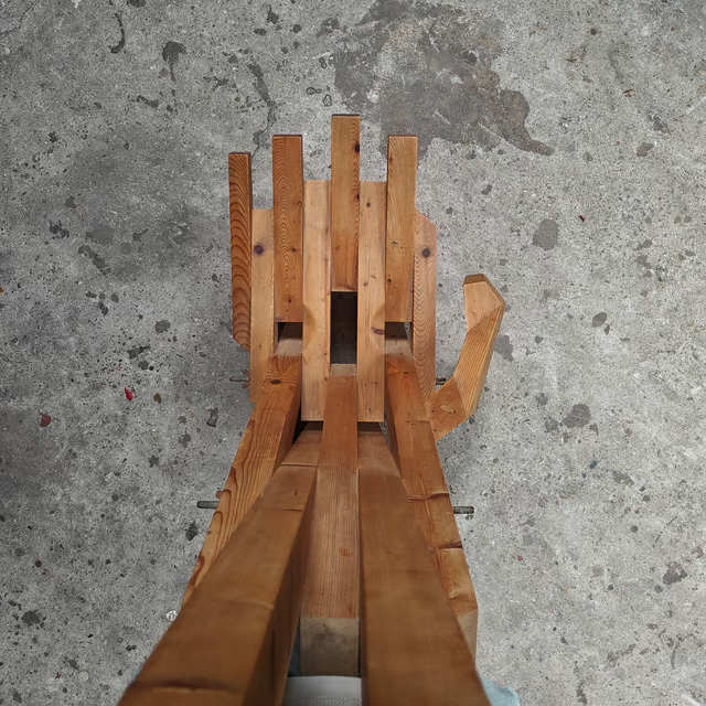 Sculptural hand shaped slatted chair 3.png