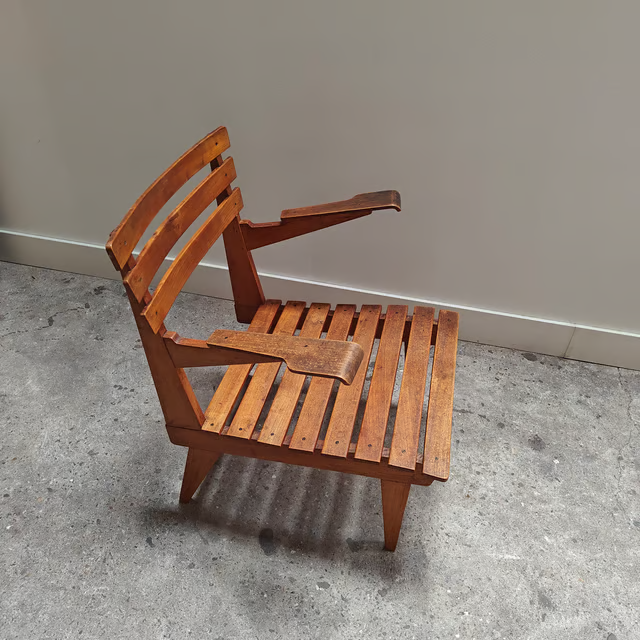 Slatted wooden armchair with modernist lines, lightweight