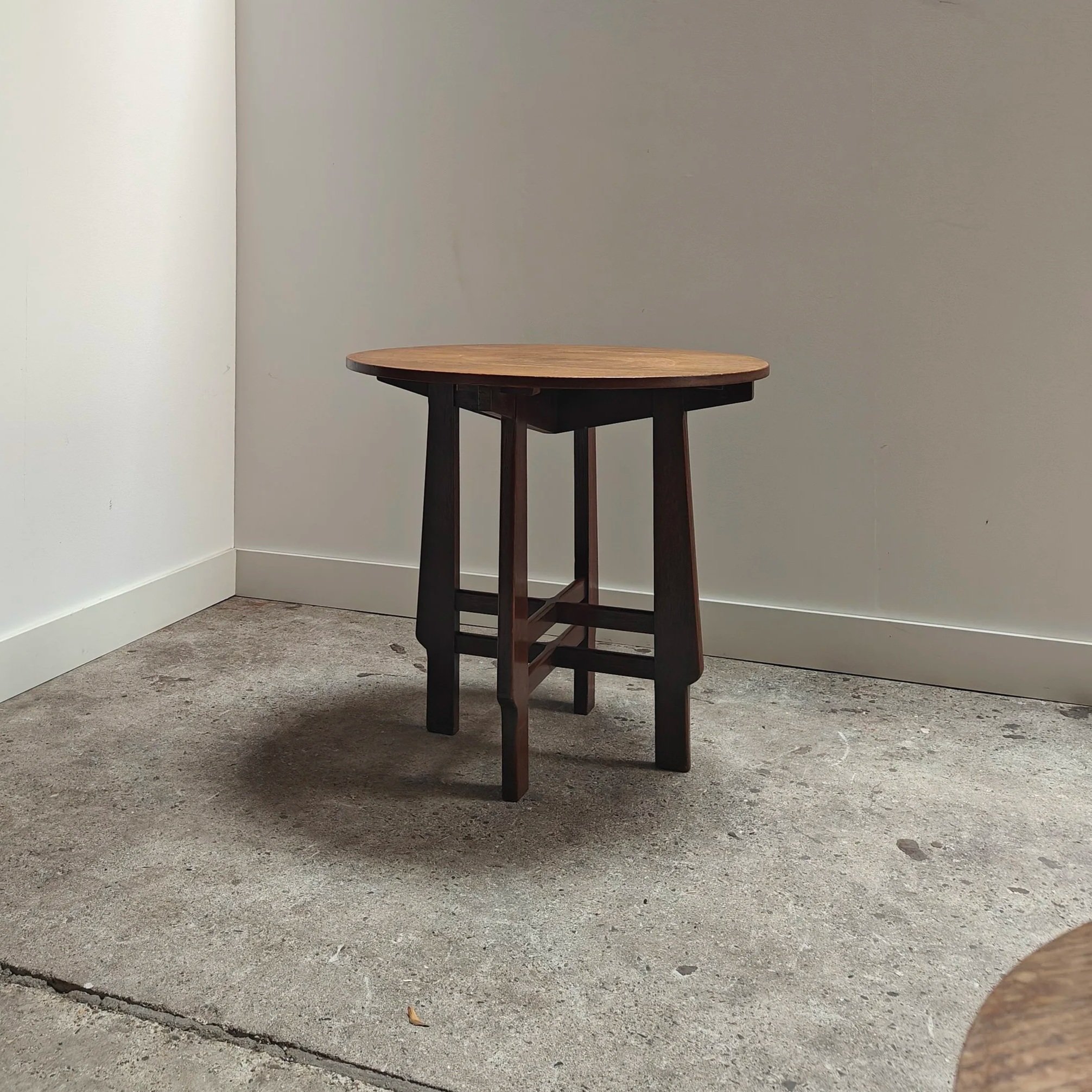 Art Deco side table with double support design feature