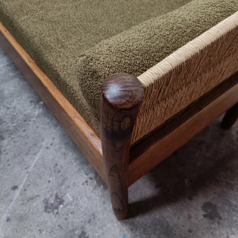 French 1950's rush sofa in olive green upholstery reminiscent to Charlotte Perriand 7.png