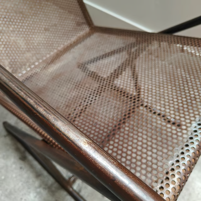 Studio made perforated zigzag armchair 9.png