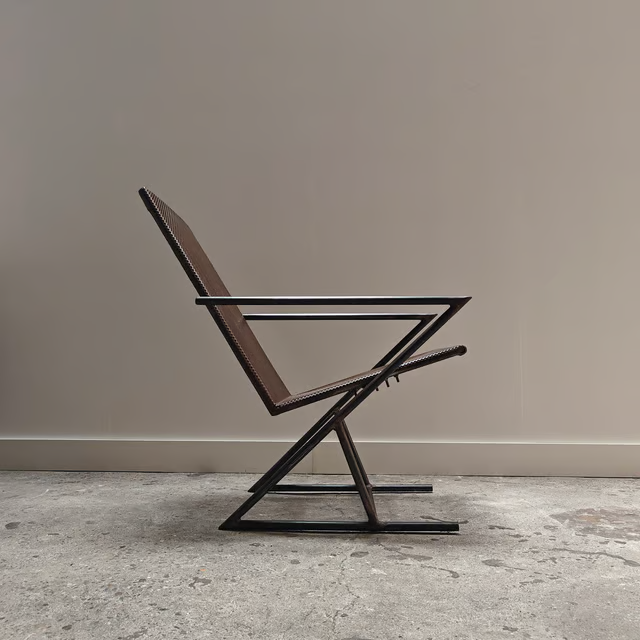 Studio made perforated zigzag armchair 4.png