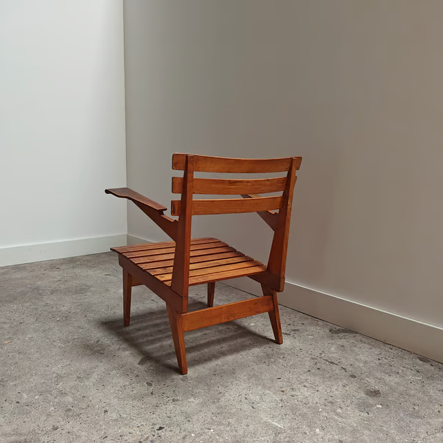 Slated wooden armchair with modernist lines, lightweight 3.png