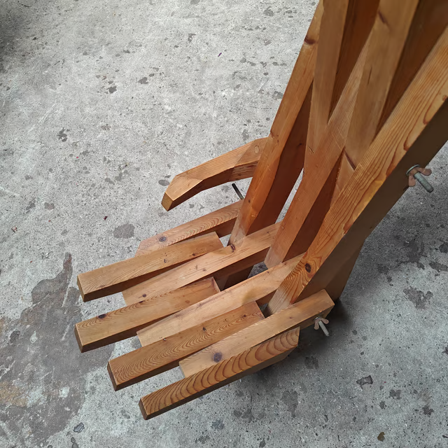 Sculptural hand shaped slatted chair 7.png