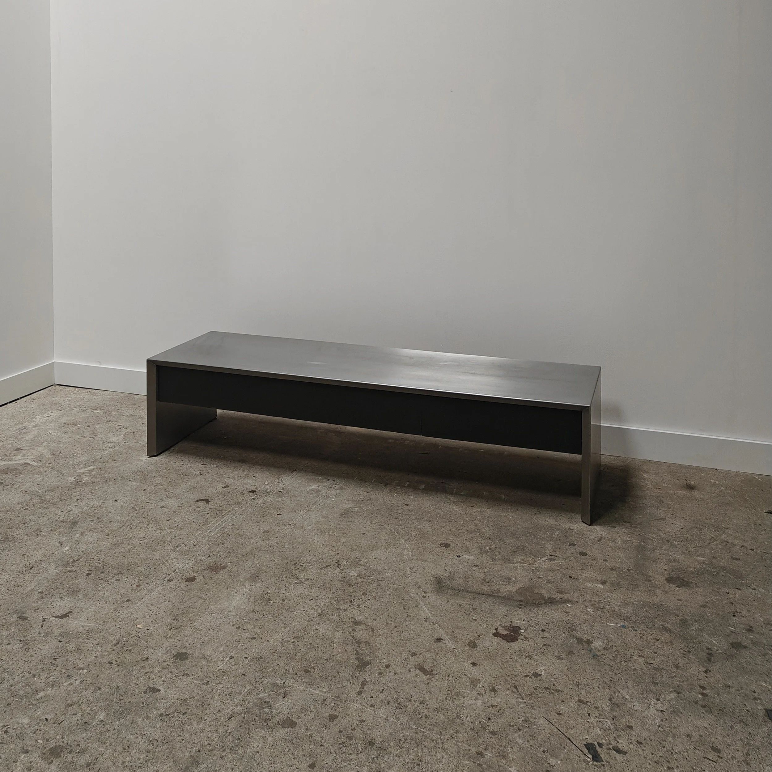1990s stainless steel design console with black drawers