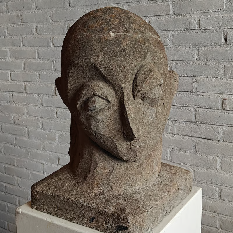 Concrete sculpture, stylized head 2.png