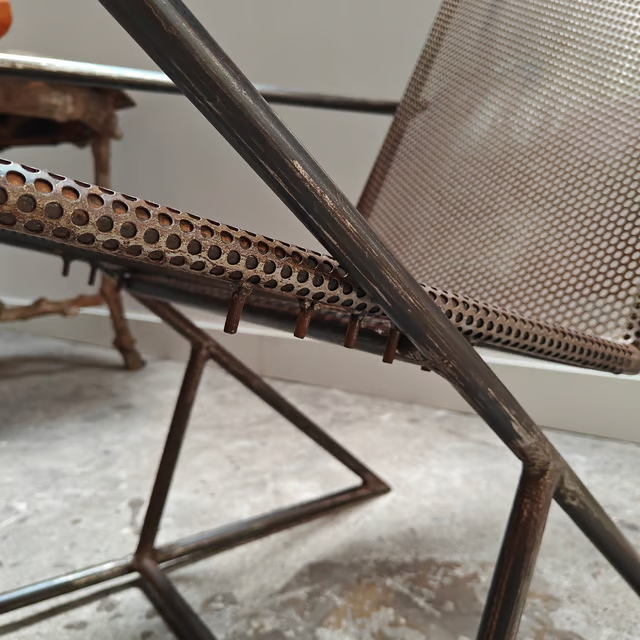 Studio made perforated zigzag armchair 8.png