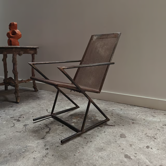 Studio made perforated zigzag armchair 3.png