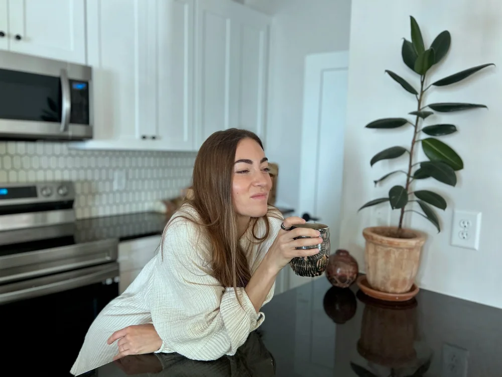 Grace Parce smiling in her kitchen