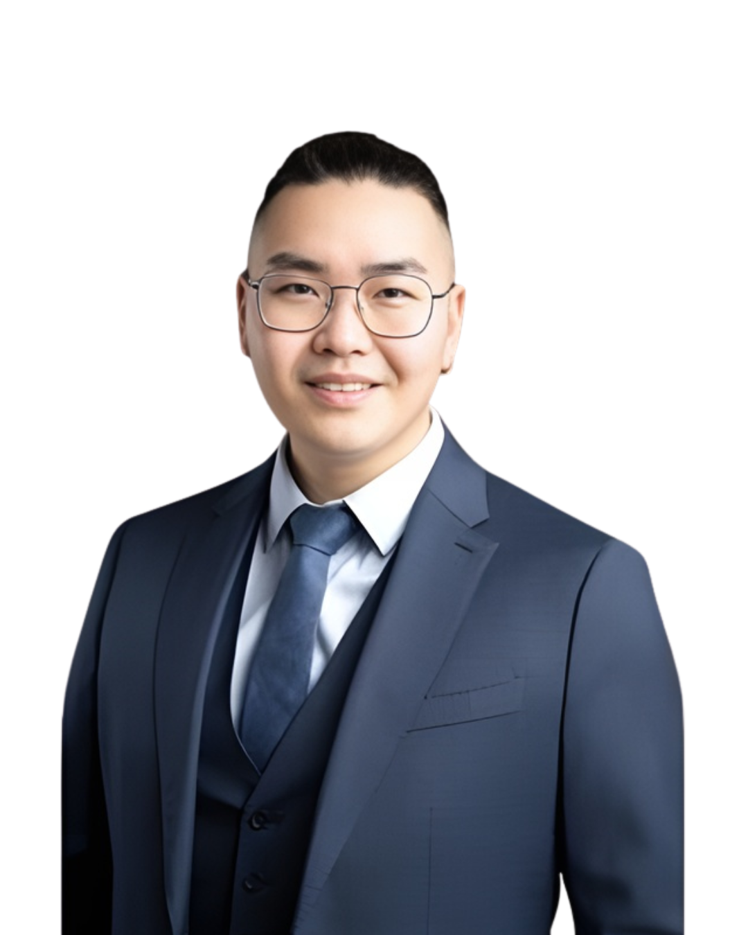 Professional portrait of a young man with glasses in a navy blue suit and tie, smiling against a white background.
