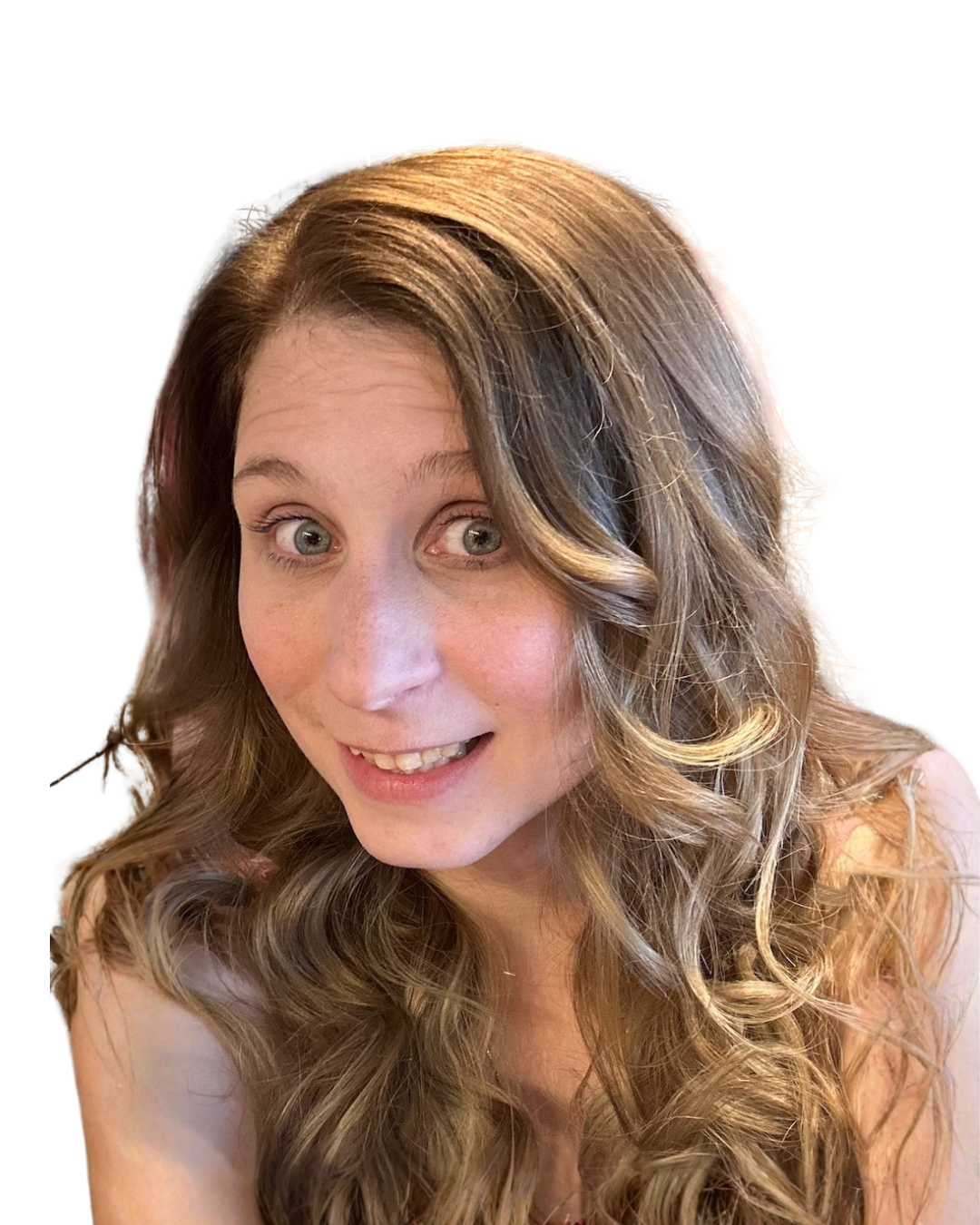 A woman with long, wavy brown hair and green eyes smiling at the camera with a white background.