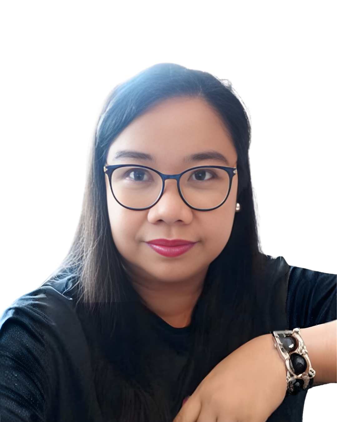 A woman with glasses and long dark hair, wearing a black top, sitting against a white background.