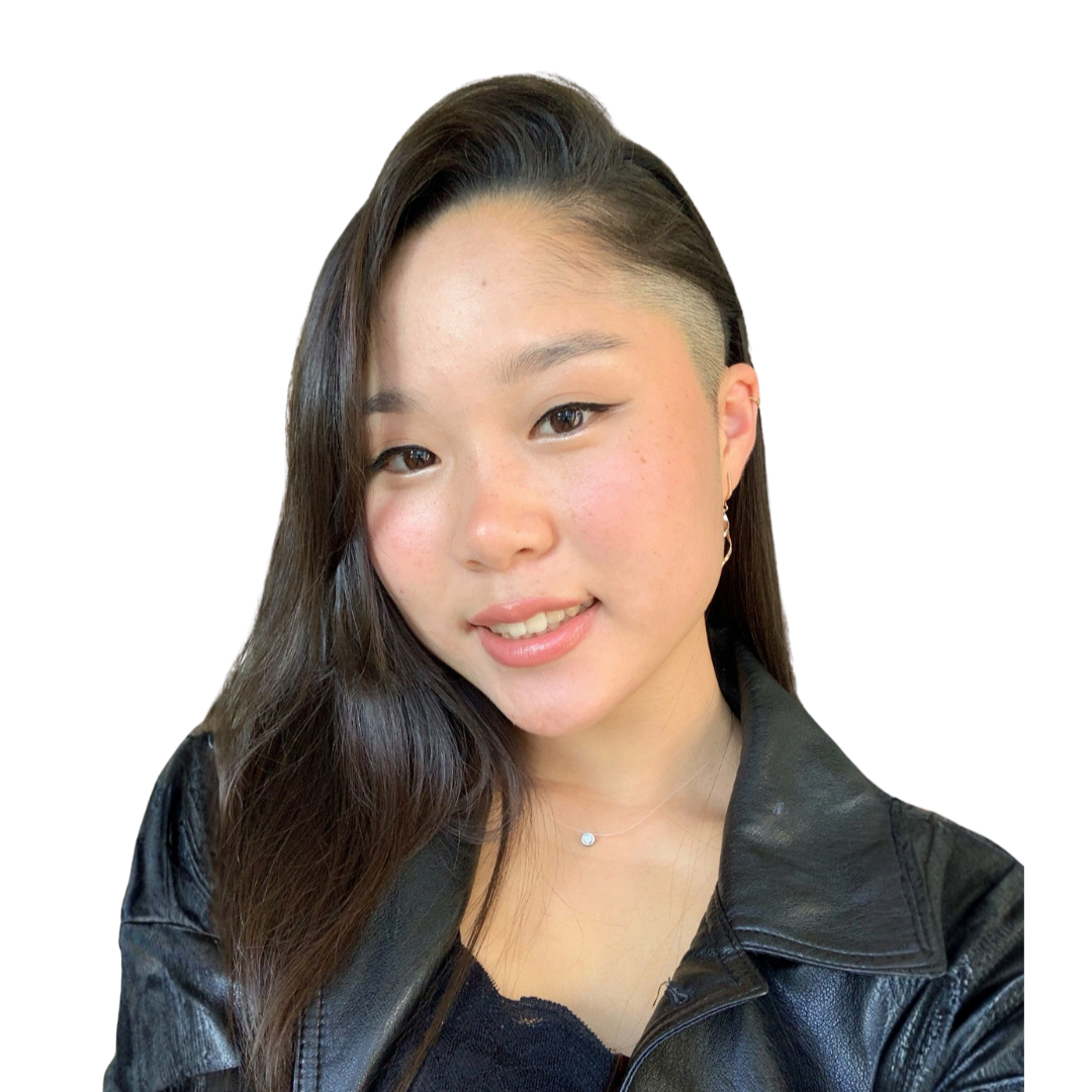 A young woman with long dark hair, styled with a side part and an undercut on one side, smiling softly, wearing a black leather jacket and a delicate necklace, against a plain white background.