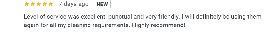 Scenic landscape of mountains, a lake, and rolling hills with scattered trees under a cloudy sky.