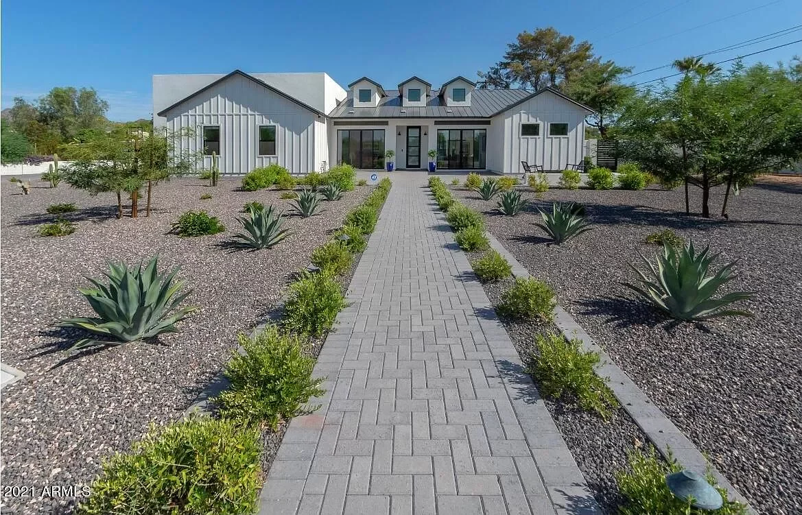 This remarkable modern estate, built in 2019, offers breathtaking views of Camelback Mountain and an elevated Arizona lifestyle. Featuring soaring high ceilings, rich wood flooring, and designer bathrooms, this home perfectly blends comfort and sophi