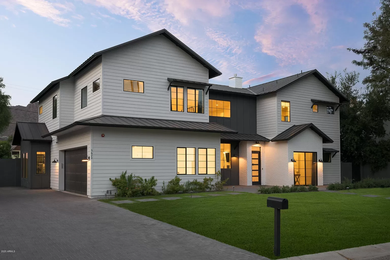 Modern custom home in Phoenix featuring 4 bedrooms and 4 bathrooms, completed as a full design-build.