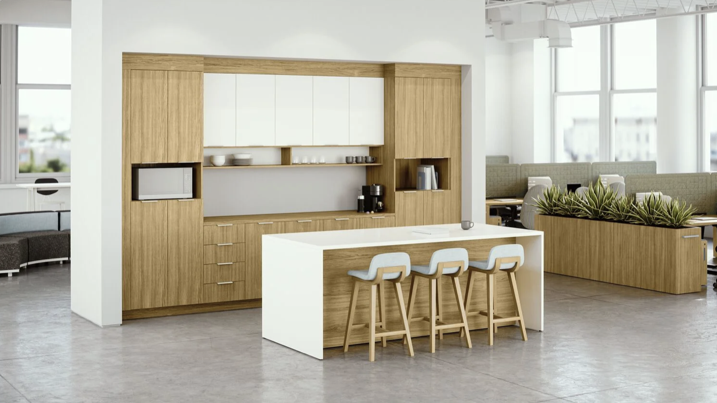 Modern kitchen with a white and wood island, three white stools, and built-in cabinets, with an open office space in the background.