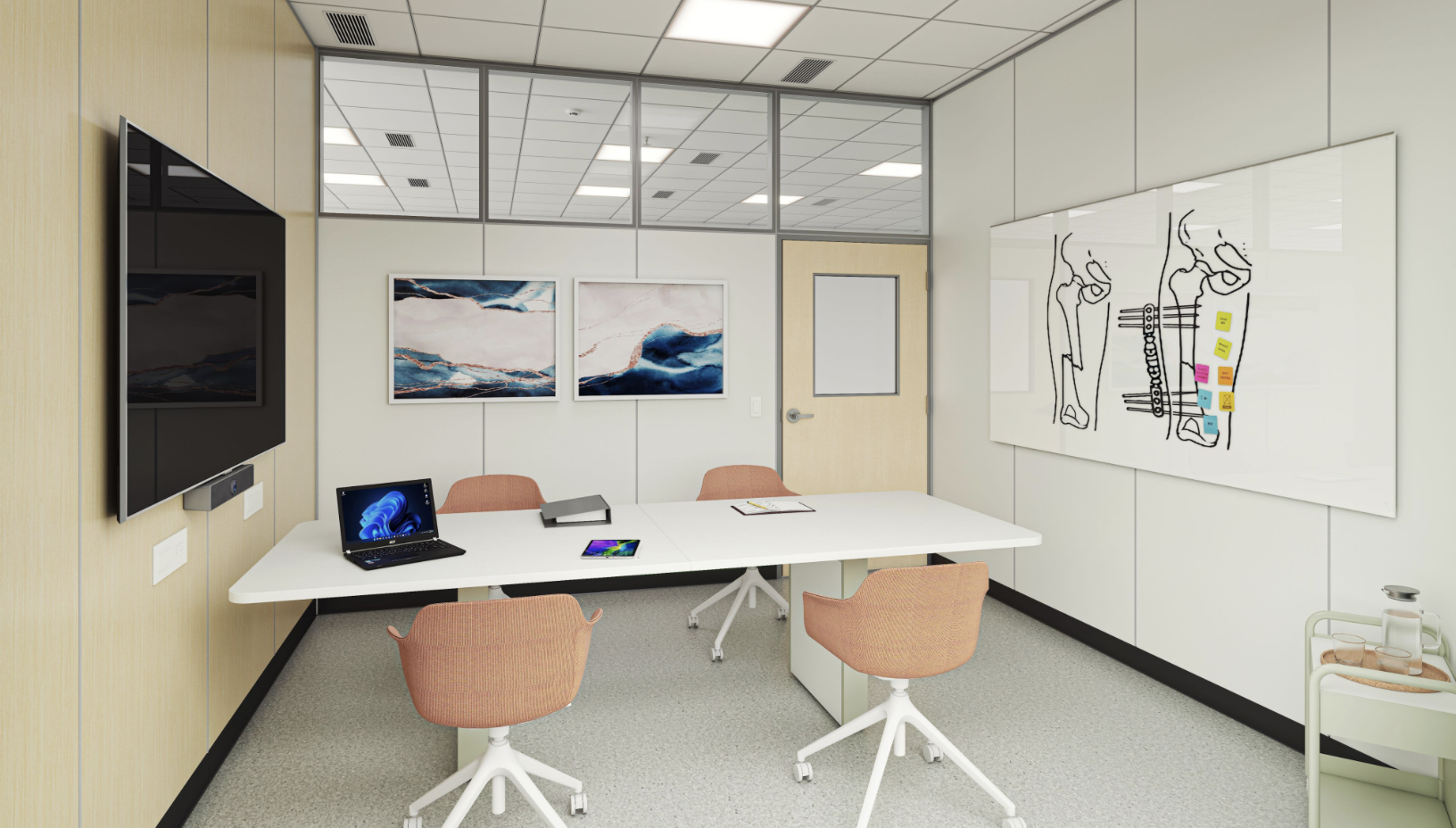 Modern conference room with a white oval table, pink chairs, wall art, a large TV, a laptop, a tablet, and a whiteboard with sticky notes.