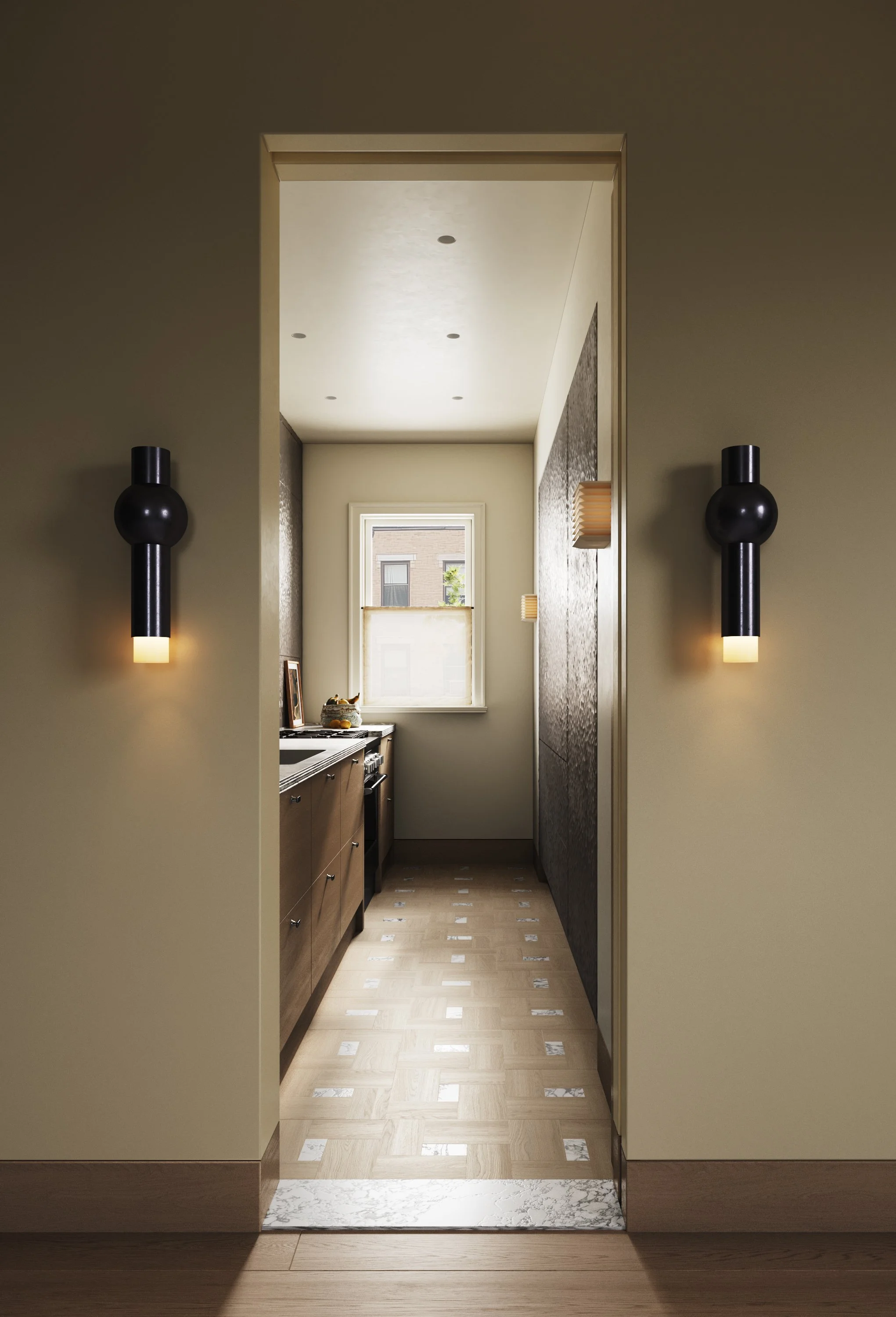 A narrow kitchen with dark wooden cabinets, a window at the end, and light-colored walls. The floor has a mix of wood and marble tiles. Black wall sconces are on both sides of the doorway leading into the kitchen.