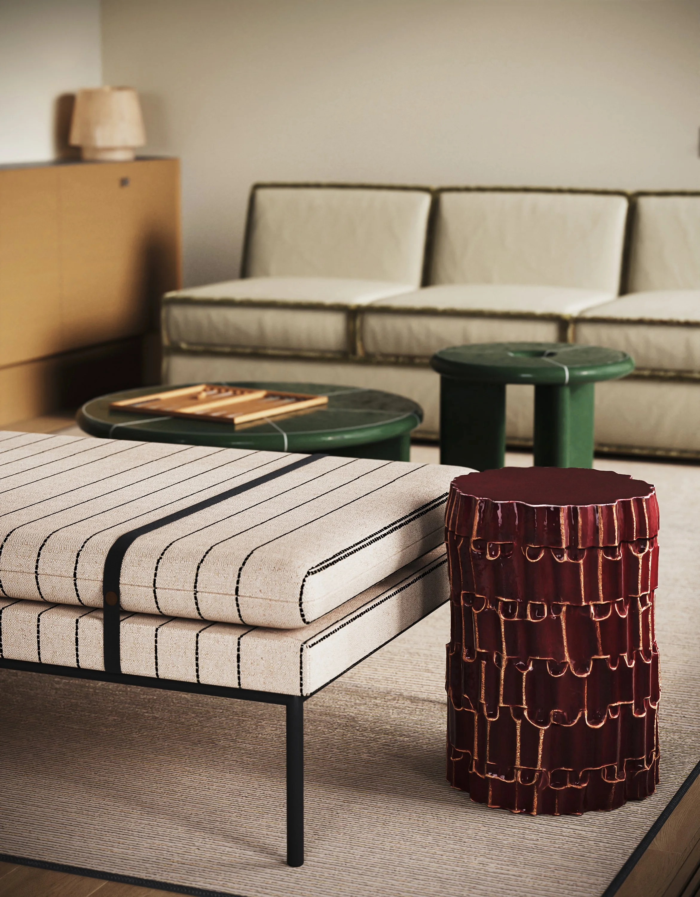 Living room with a striped upholstered bench, a red decorative side table, a white sofa with green trim, and two small green tables with a chessboard, in a mid-century modern style.
