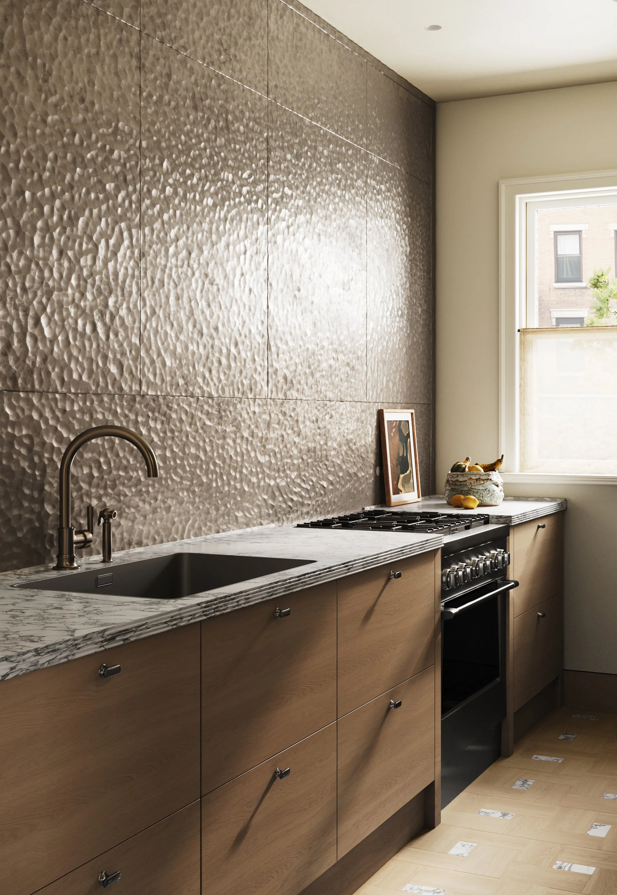 A modern kitchen with a textured metallic backsplash, wooden cabinets, a marble countertop, and a stove near a window with natural light.