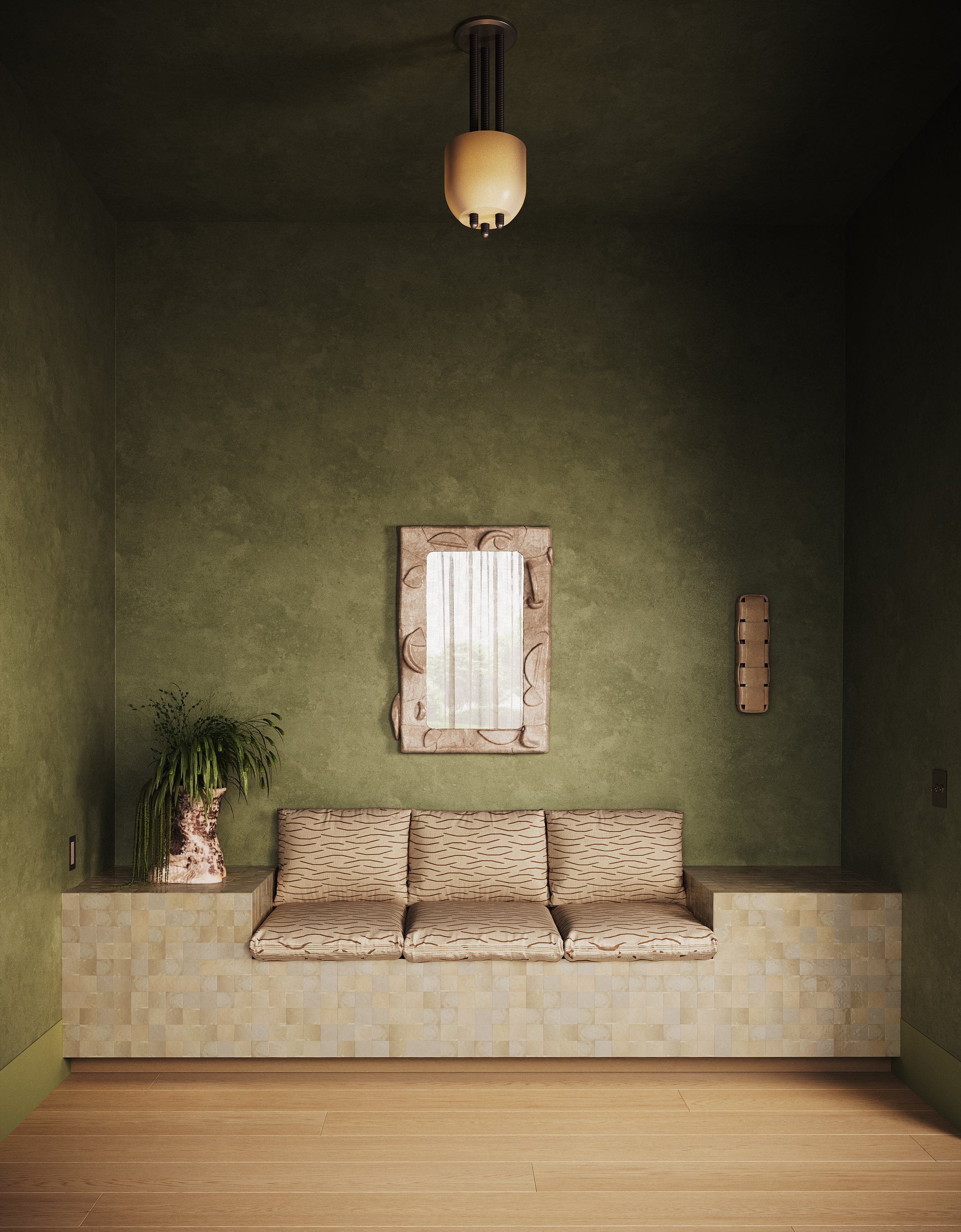 A minimalist room with green walls, a beige bench with four cushions, a plant on the left, a mirror above the bench, a wall-mounted wooden item on the right, and a ceiling lamp.