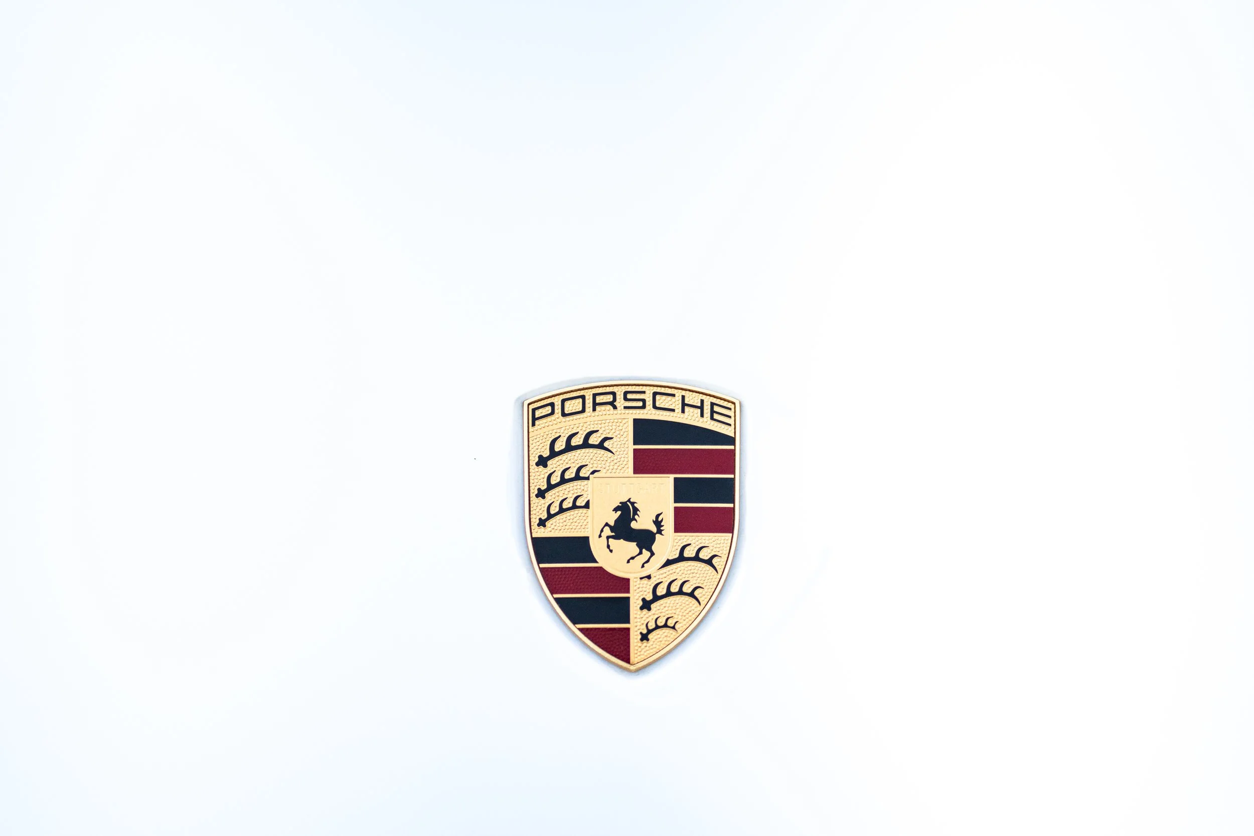 Porsche logo on a white background