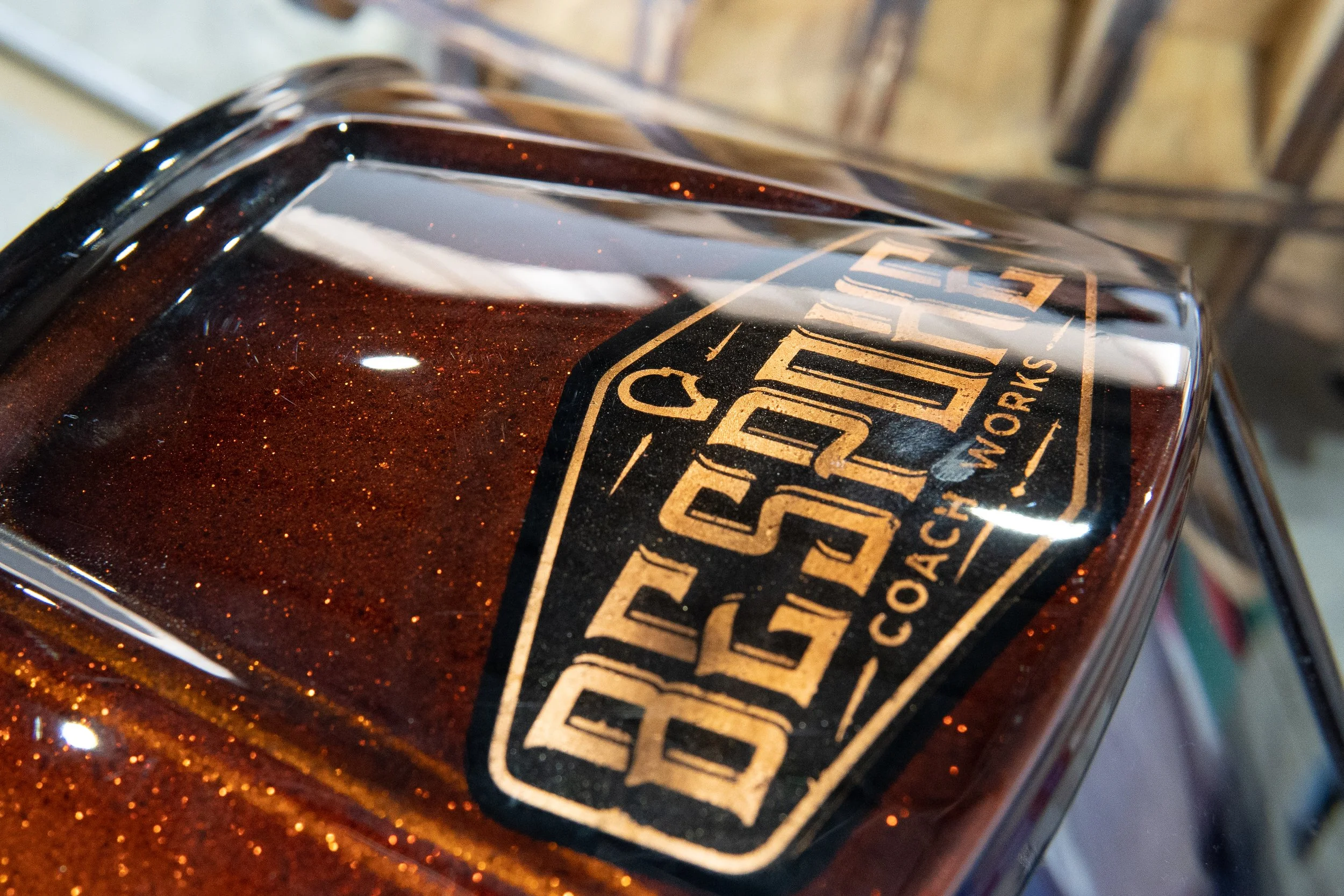 Close-up of a glass of bourbon whiskey with a black and gold label reading 'Gold Rush Co.