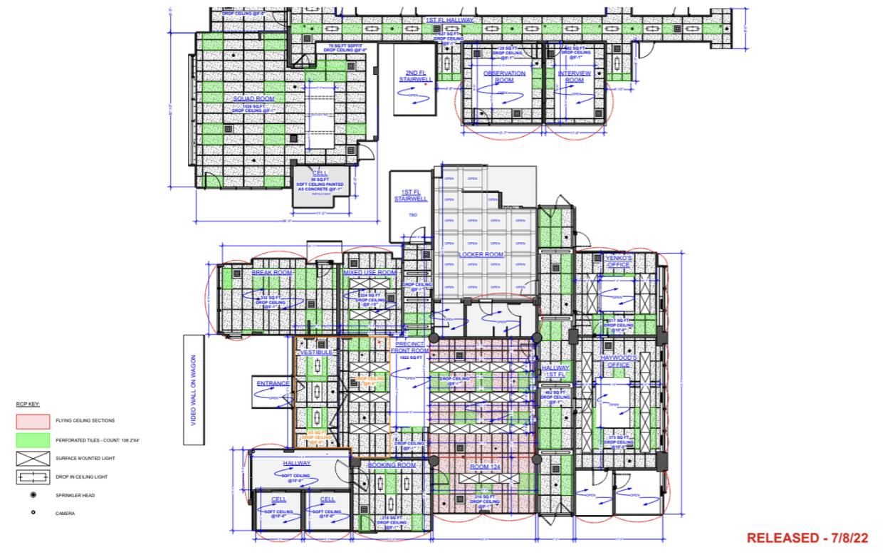 Detailed architectural floor plan of a building, showing various rooms such as offices, hallways, conference rooms, and stairwells with measurements, labels, and safety features.