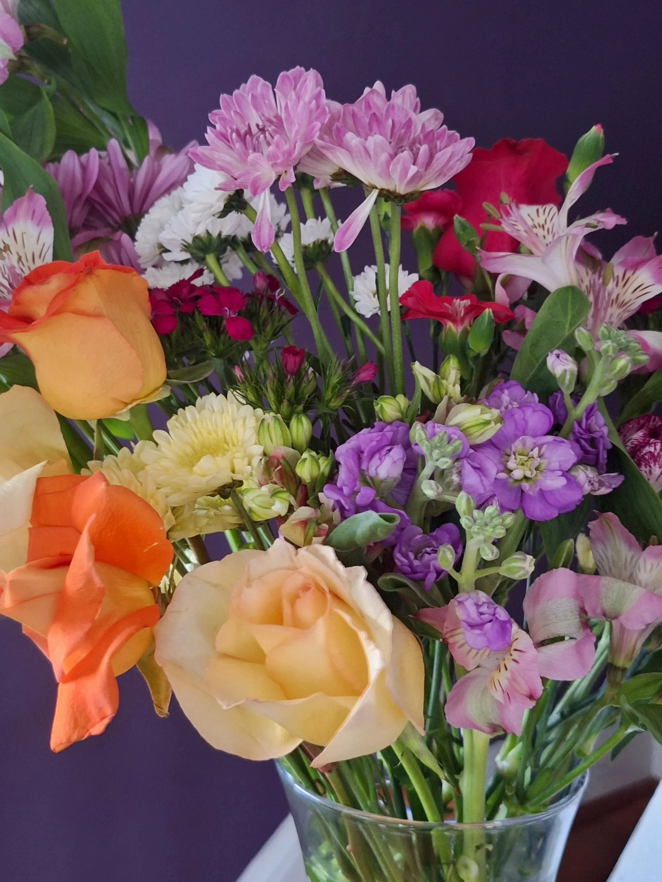 A beautiful "wild" arrangement for a tough, yet equally as beautiful and "wild" client, featuring showstopping alstroemeria (so underrated) and orange roses!