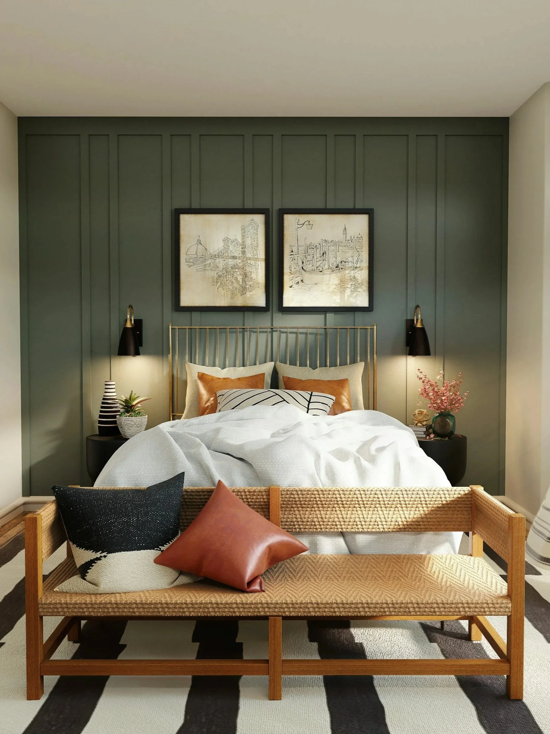 A bedroom with a green accent wall, framed artwork, a brass bed with pillows, bedside tables with lamps, and a wooden bench at the foot of the bed with decorative pillows.