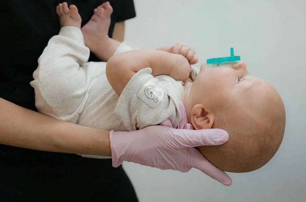 Take a look at this sweet baby.

Hands at midline, slight extension of the head and neck, no sign of brow tension, and independence with a pacifier to target his non-nutritive suck pattern! He initially struggled in this position, but slowly got the 