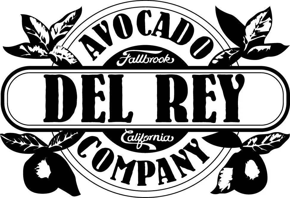 Logo for Avocado Del Rey Company in California, featuring bold text and avocado leaves in black and white.