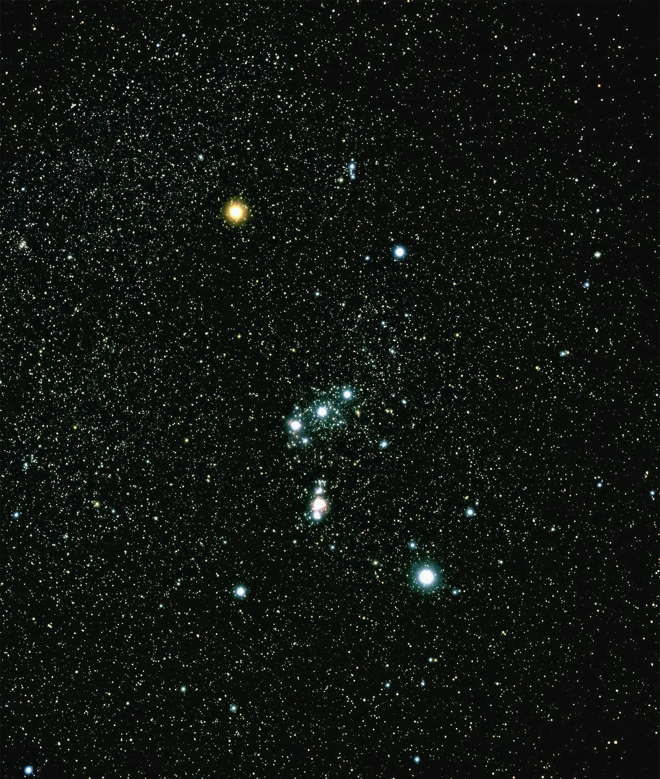 A dense star field in space with numerous stars and celestial objects scattered across a dark background.