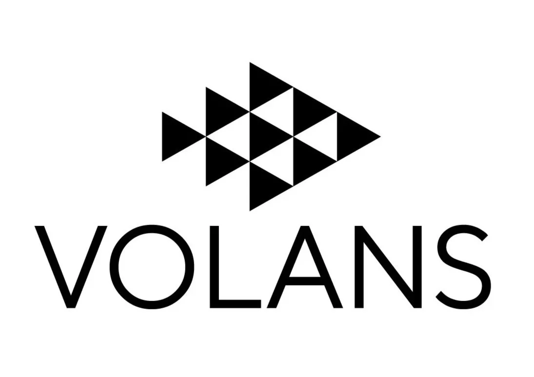 Black and white logo with a geometric pattern above the word 'VOLANS' in uppercase letters.