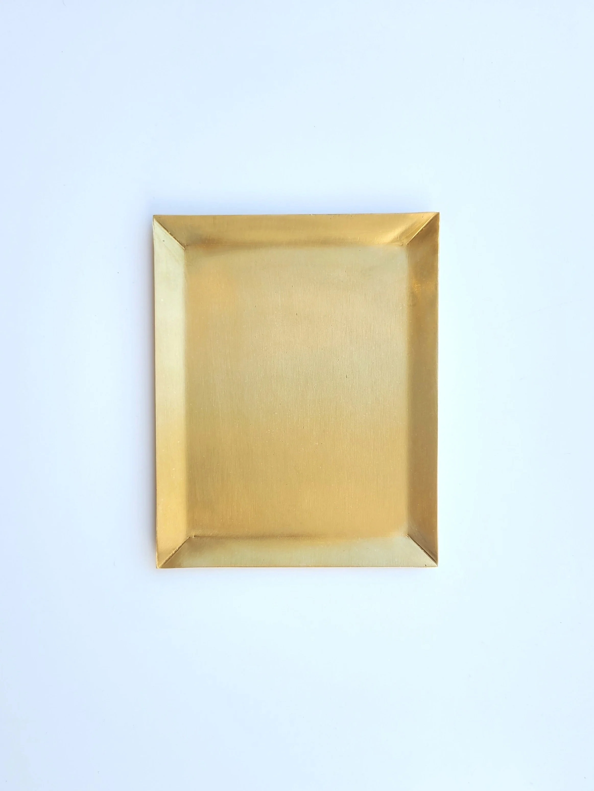 Golden rectangular tray on white background