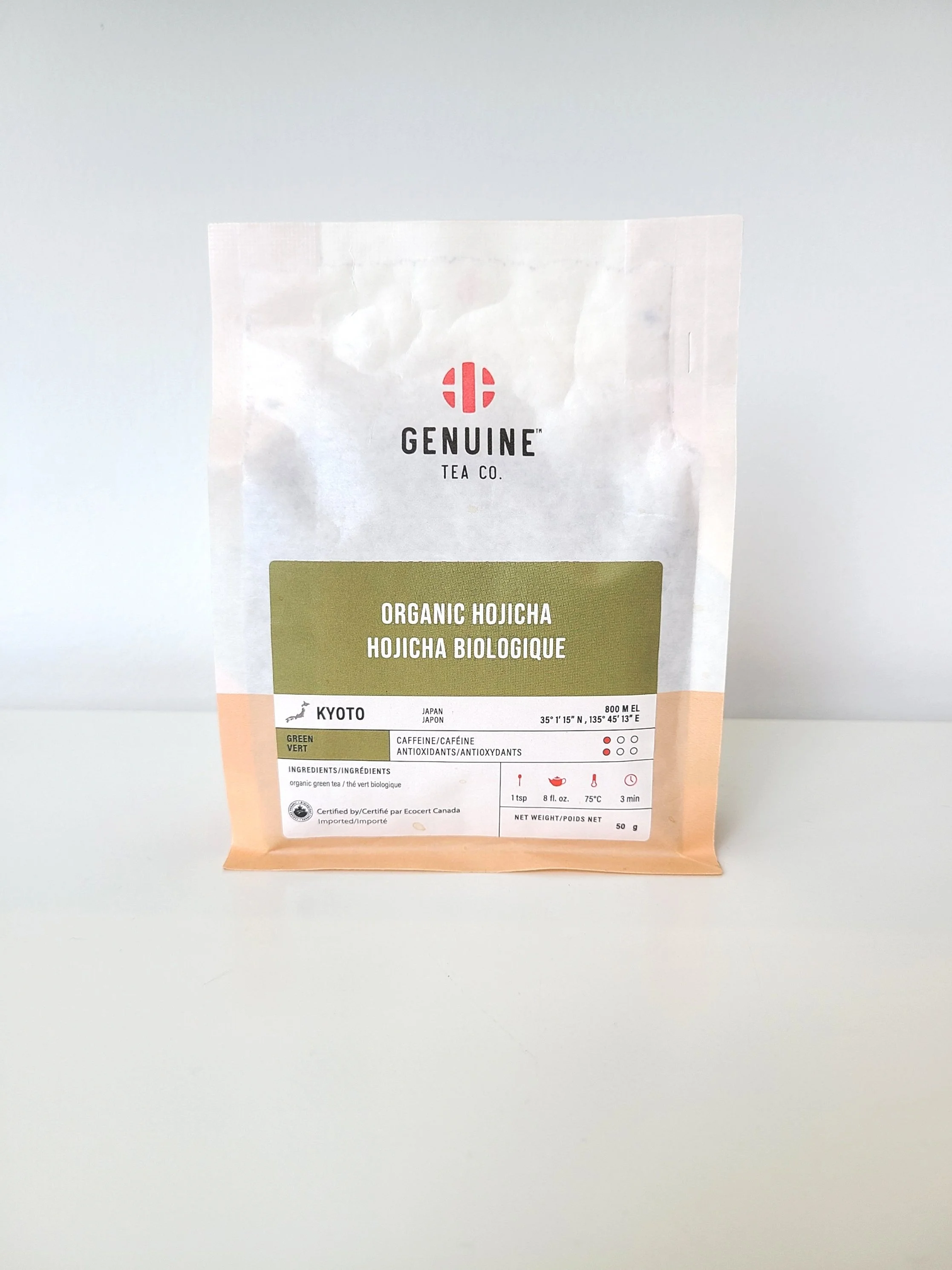 Package of Genuine Tea Co. Organic Hojicha tea with Japanese origin, green tea variety, and caffeine content.