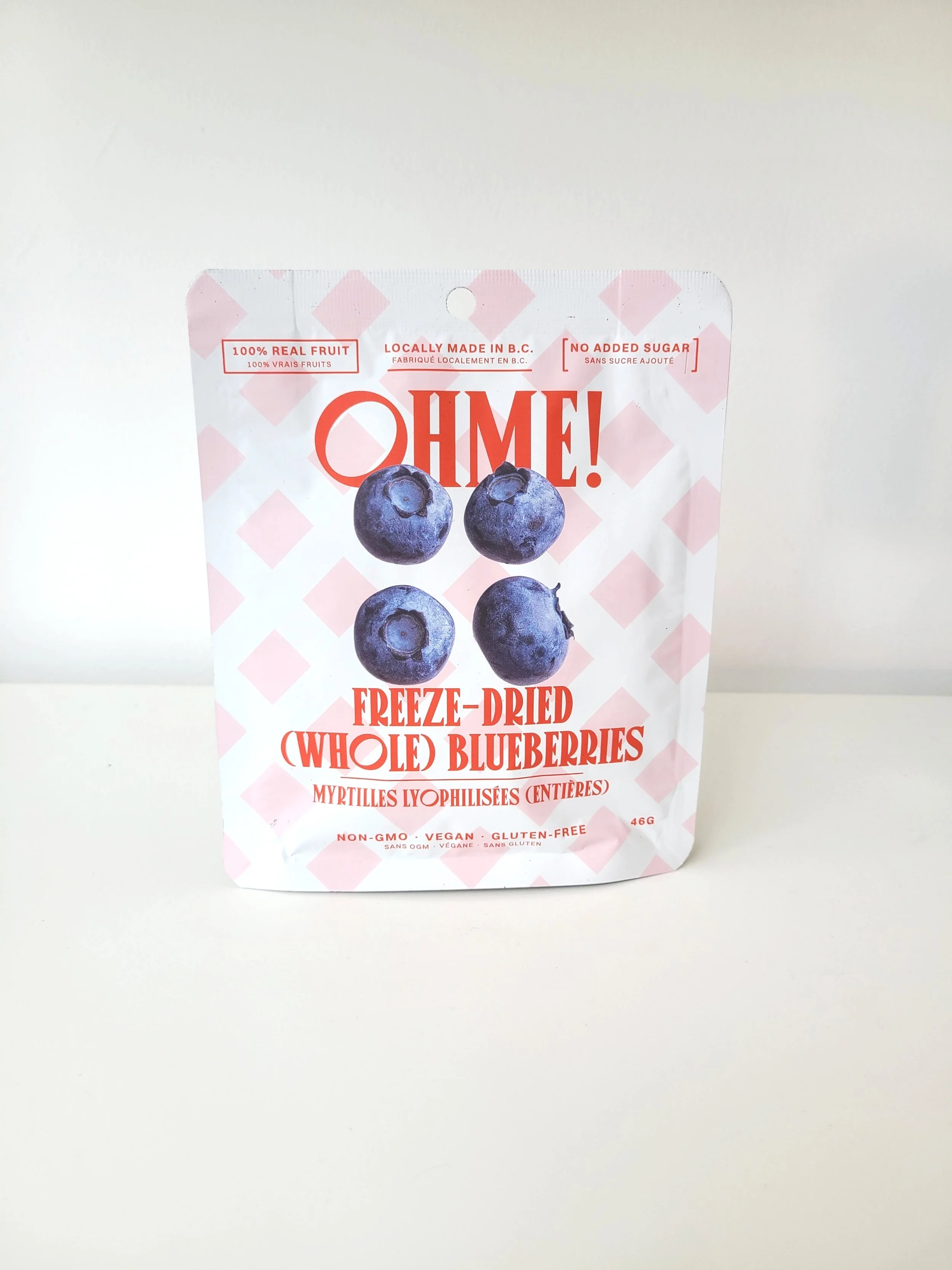 Package of freeze-dried whole blueberries with blueberries images on the front, displaying that it is made in B.C., contains no added sugar, and is non-GMO, vegan, and gluten-free.